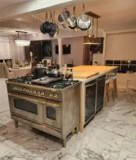 Huge island, custom range and two wine fridges