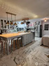 Large kitchen custom island and range stove