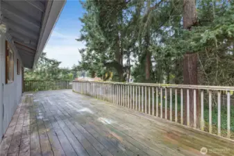 Large deck outside of French doors overlooking fully fenced yard.