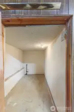 Extra storage space under the stairs in the lower bonus/family room.