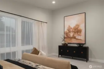 Primary bedroom offers comfort, space, and peaceful ambiance.