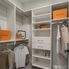Custom walk-in closet with built-in shelving and storage.