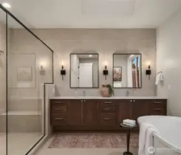 Spa-inspired primary bath with dual vanity and designer finishes.