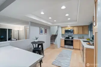 Bright kitchen with easy flow to nearby living spaces and a cozy spot for casual seating.