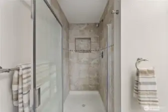 Step into the tiled walk-in shower in the primary ensuite, creating a spa-like space to refresh and unwind.