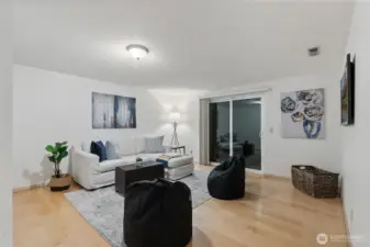 This comfortable and open flex space makes a great secondary living area while offering easy indoor-outdoor living potential