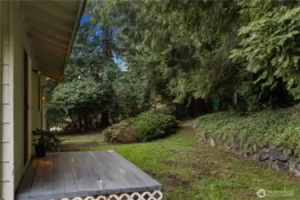 Surrounded by nature, this spacious yard invites you to create your own outdoor sanctuary.