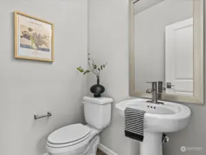 Powder room in between the dining and living room.