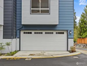 Large, 2-car garage with EV charging.