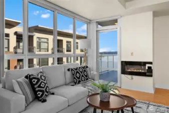 A wall of windows attracts natural light filling the condo with brightness and cheer. A glass door entry to a covered patio is convenient for year round use.  Use the electric plug in fireplace to cozy up on a cold winter evening!