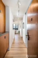 Entry has custom cabinetry pictured & large closet on the right.