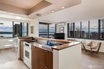 Kitchen remodel removed wall creating a modern, open floor plan
