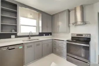 Updated kitchen with stainless steel appliances.