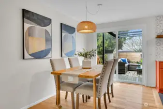 Well lit dining room with handy access to the backyard