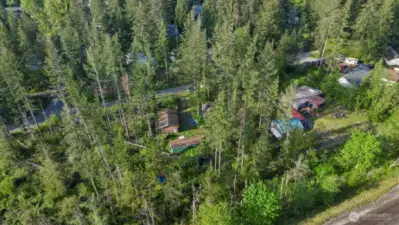 Overhead view, wooded area to the left is part of the property, 1.20 acres