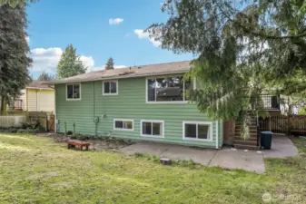 Spacious backyard for gardens, entertainment, & more; recently mowed, bring your visions.