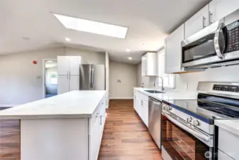 Kitchen with stainless steel appliances and quartz counters