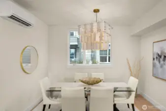 Formal dining nook with designer lighting and built-in bench seating—host your next gathering in style.