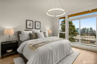 Unwind in your sun-drenched primary suite, thoughtfully positioned for ultimate privacy and comfort. The room flows seamlessly into a custom walk-in closet with built-ins, and an en-suite spa-inspired 5-piece bathroom, making this a true sanctuary within the home.