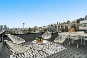 Stunning rooftop deck with sweeping views of the Seattle skyline and Elliott Bay.