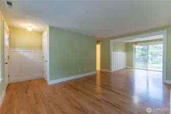 White Wainscoting thru out, freshly painted interior, and Bold Wide White Trim, with Hardwood Flooring.