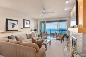 The living room is an ideal space for entertaining, where you can enjoy the constant parade of marine life, ferries, herons, and eagles passing by.