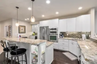 Imagine a top-notch kitchen where every detail shines. You’re preparing a special dinner as friends sit at the counter, enjoying the show while sipping wine. The space is light, bright, and open, with sweeping views that make the room feel endless. Every element—from the gleaming surfaces to the effortless flow—invites connection, conversation, and delight.