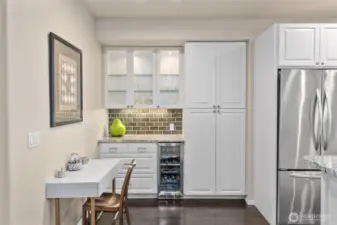The built-in wine fridge and pantry offer ample storage and convenient access.