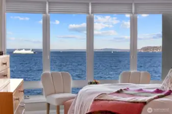 Moving into the Primary Suite, you’ll be greeted by nearly floor-to-ceiling windows that frame breathtaking views of the Olympic Mountains and Puget Sound, with the ever-moving Ferries adding a dynamic touch to the scenery. Imagine waking up each day to this stunning panorama!