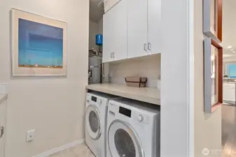 The laundry room features a wash sink to the left.
