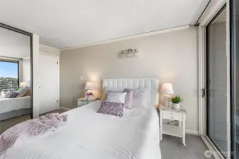 Primary bedroom retreat with sliding glass doors and tranquil marina outlooks.