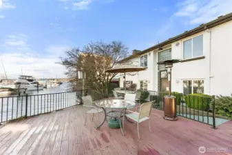 Community deck area adjacent to the water, ideal for socializing or quiet reflection.