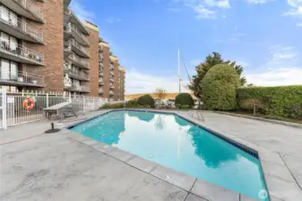Outdoor swimming pool overlooking the water—perfect for summer relaxation.