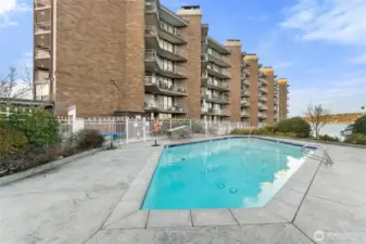 Pool area with expansive deck space and marina views.