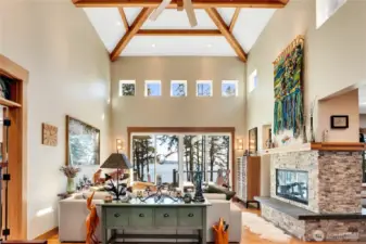 The front foyer opens directly to views of the Salish Sea and Mt. Baker, immediately establishing the home’s orientation and setting. Fourteen-foot ceilings and exposed beams reflect solid craftsmanship and create an open, functional main living area.