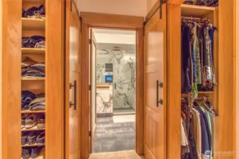 Carpeted flooring with luxury padding transitions to tile in the ensuite, where radiant heated floors add comfort.