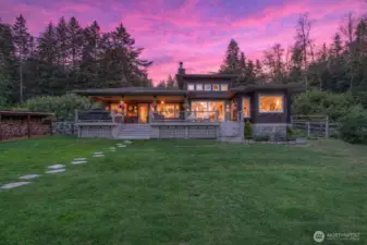 The home is built on a raised foundation with crawlspace, while the bunkhouse and garage sit on poured concrete slabs, providing solid structural support.