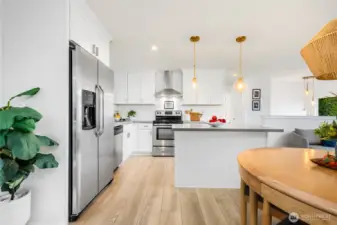 Designer kitchen with quartz counters and matching stainless appliances