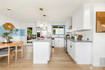 Designer kitchen with quartz counters and matching stainless appliances