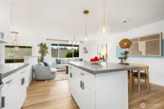 Designer kitchen with quartz counters and matching stainless appliances