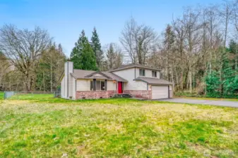 Private NW Contemporary set well back from the road on five level acres.