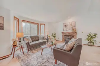 Spacious living room highlighted by vaulted ceilings.