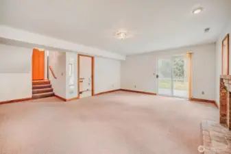 Spacious lower-level family or bonus room. Adjacent bathroom adds convenience.