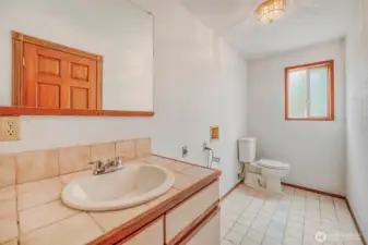 Lower-level bath enhances flexibility for guests.