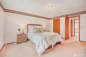 Primary bedroom offers comfort and privacy.