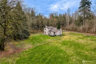 Mature trees frame the home with privacy and year-round beauty.