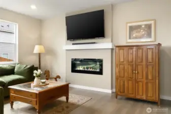 Serene living room w/ electric fireplace & mantel