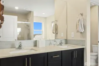 Primary Bathroom with under-counter mounted sinks and real Quartz counters