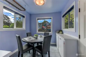 Convenient dining area just off of the kitchen also provides access to backyard and parking.