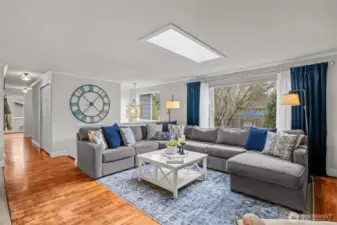 Living room with hardwood floors, and territorial front yard views.